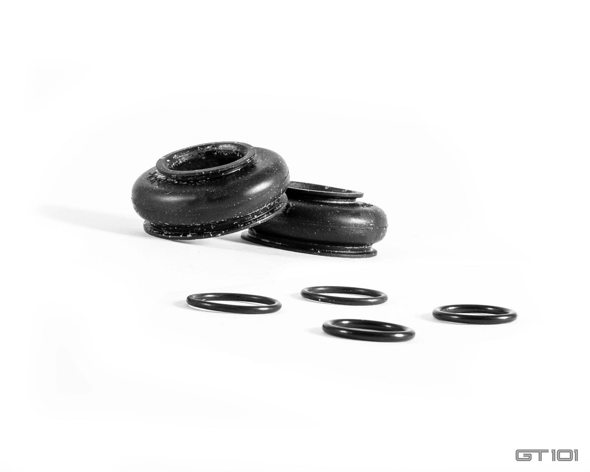 Replacement rear lower control arm outer joint rubber dust boots and retaining rings for 2005–2006 Ford GT.