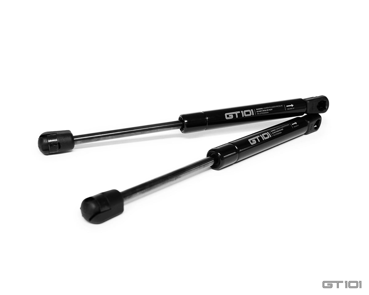 GT101 replacement front stowage compartment gas struts for 2005–2006 Ford GT, direct OE fit, supplied as a matched pair.