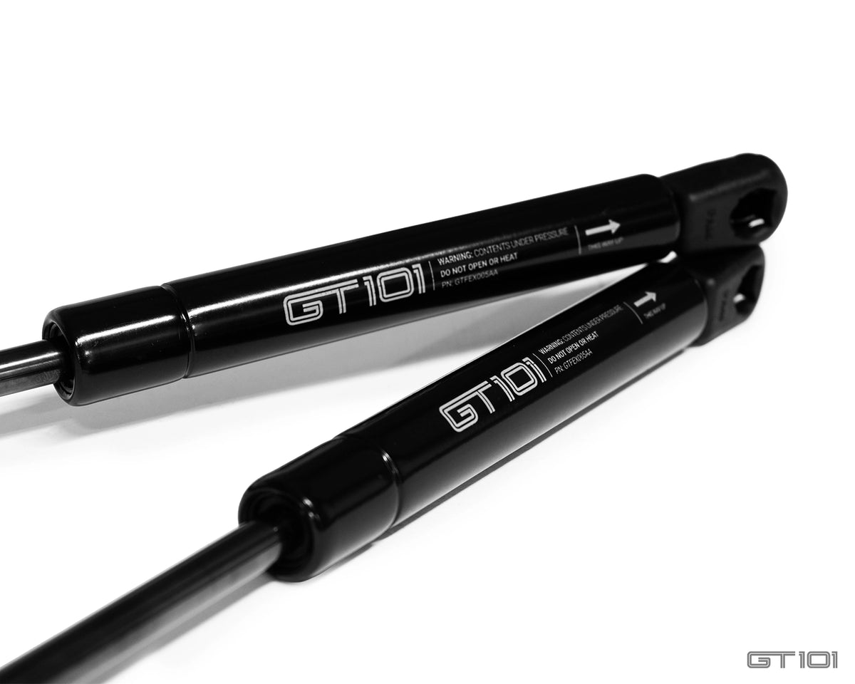 GT101 replacement front stowage compartment gas struts for 2005–2006 Ford GT, direct OE fit, supplied as a matched pair.